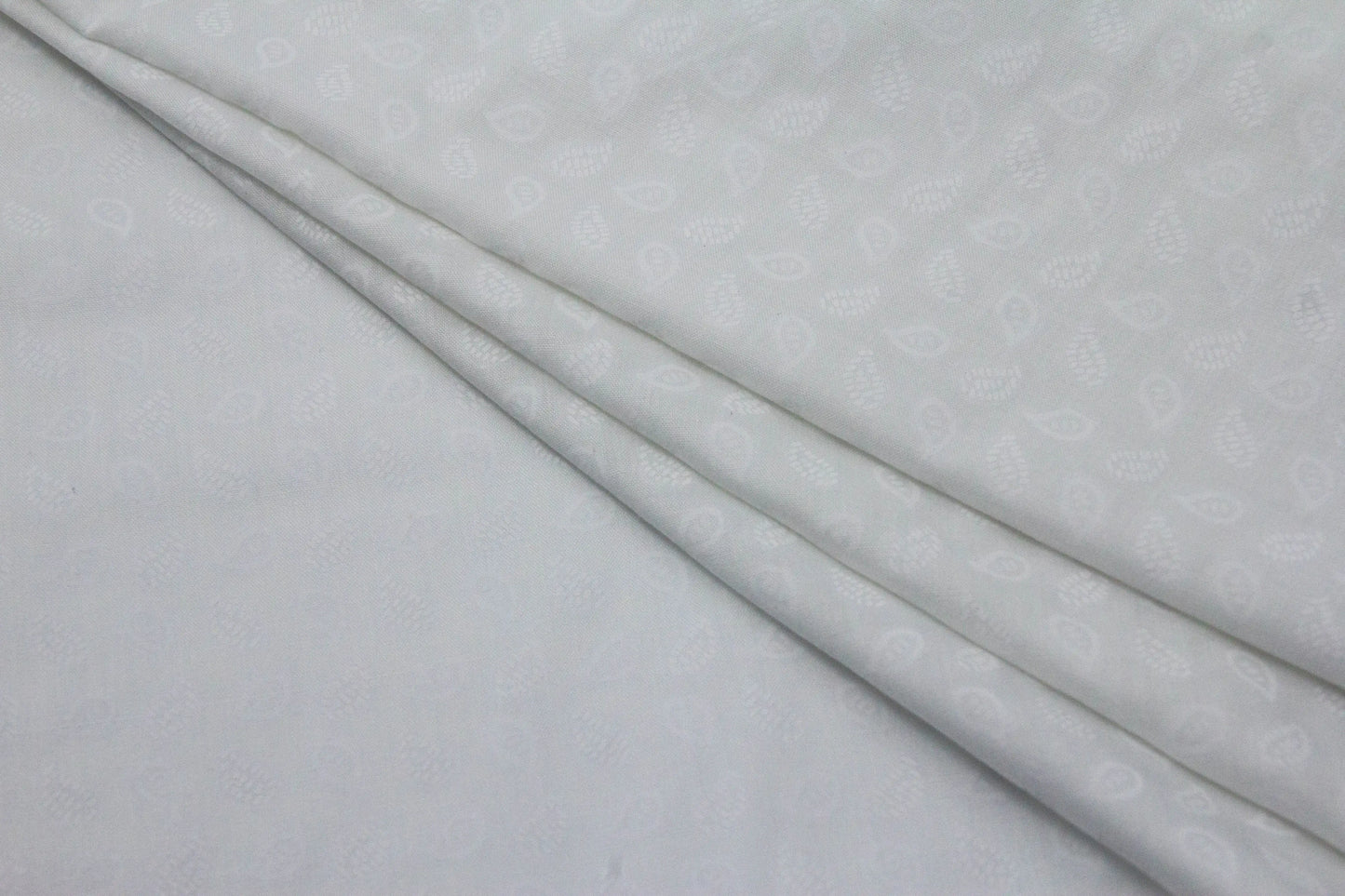 Cotton Self Design Emboss Leaves Fabric
