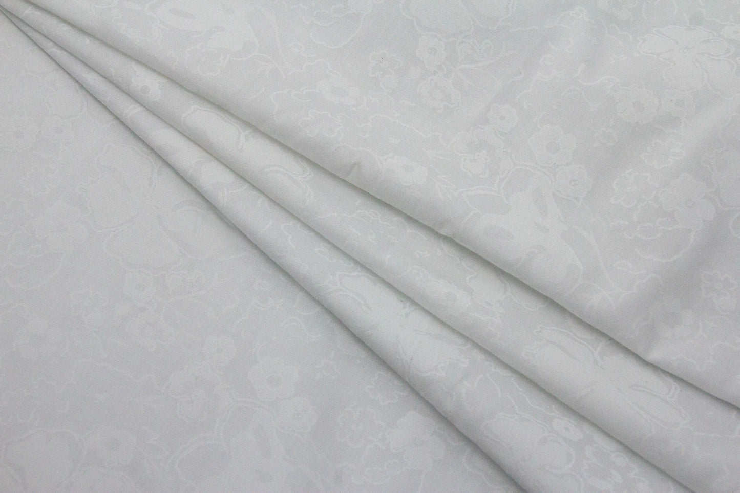 Cotton Self Design Emboss Floral Fabric